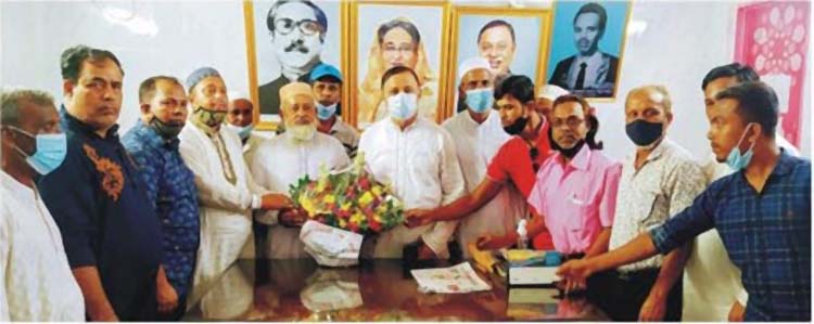 এমপি হাসেম খাঁনকে পূর্ণমতিবাসীর উদ্যোগে ফুলেল শুভেচছা 